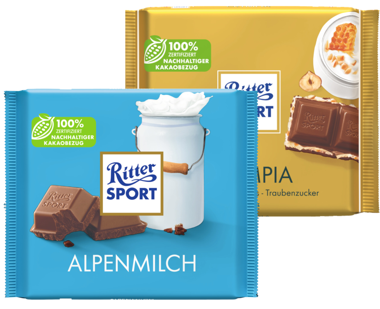 Zu sehen sind zwei Packungen Schokolade der Marke "Rittersport"; unter anderem die Sorte "Alpenmilch" und "Olympia" je 100 Gramm.